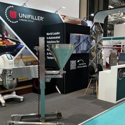 Unifiller booth with machines on display at FoodEx